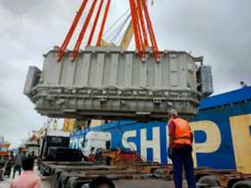 Heavy electrical equipment being lifted
